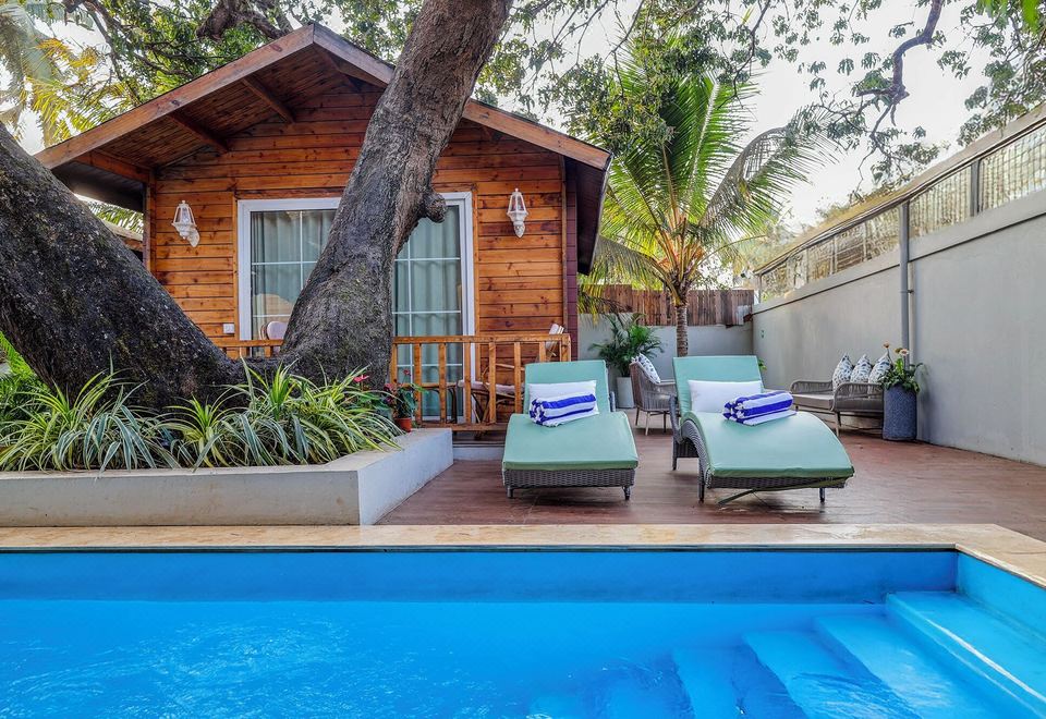 The Village Boutique Resort Pool and Cottages at Dusk